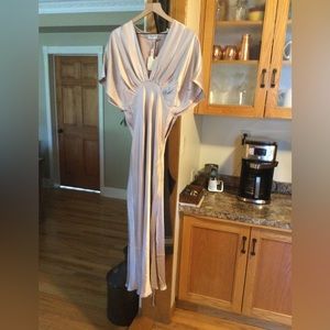 Champagne colored, long with thigh slit, shawl sleeves.